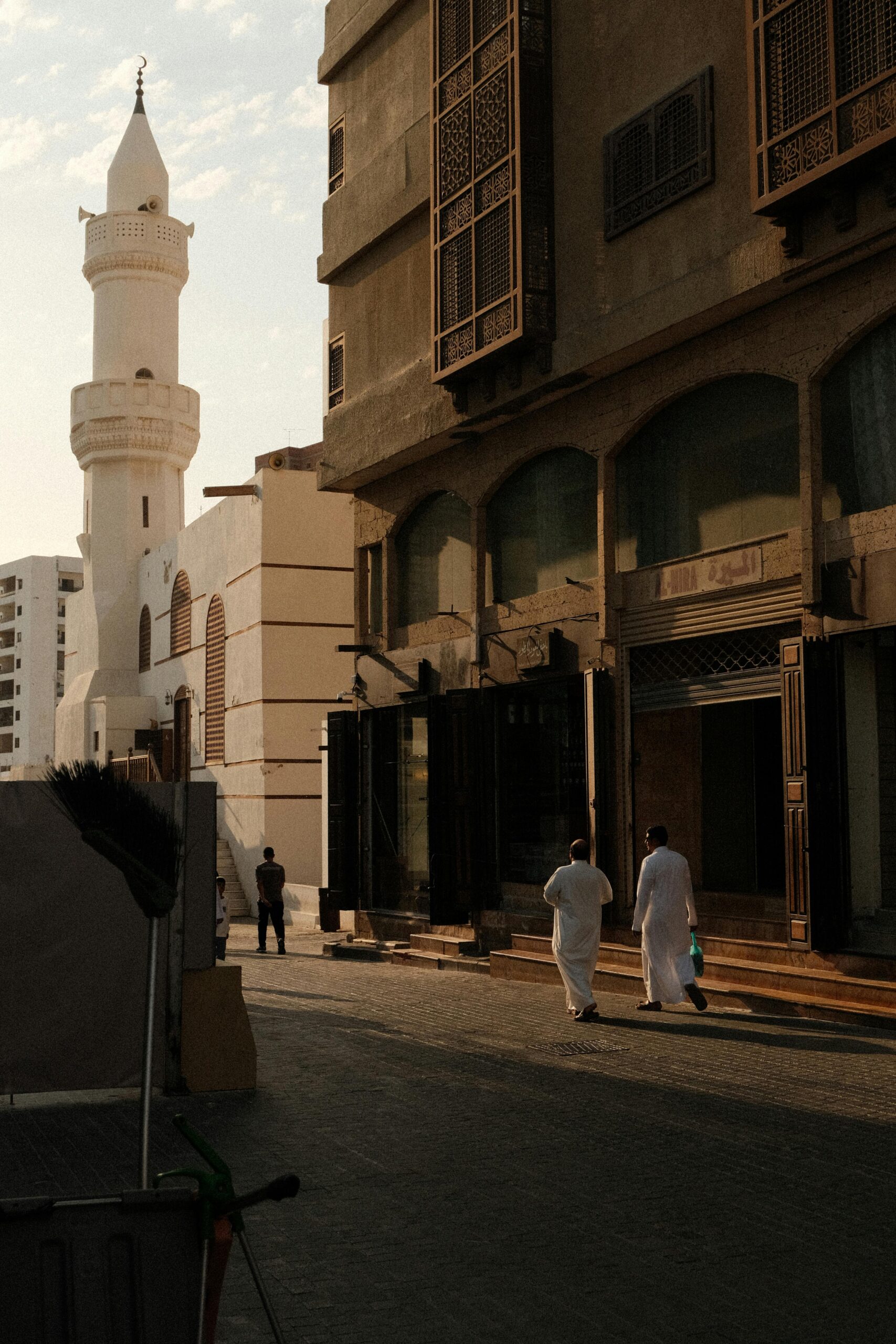 Scenic view of traditional Saudi architecture in a historic Jeddah street, with local culture.