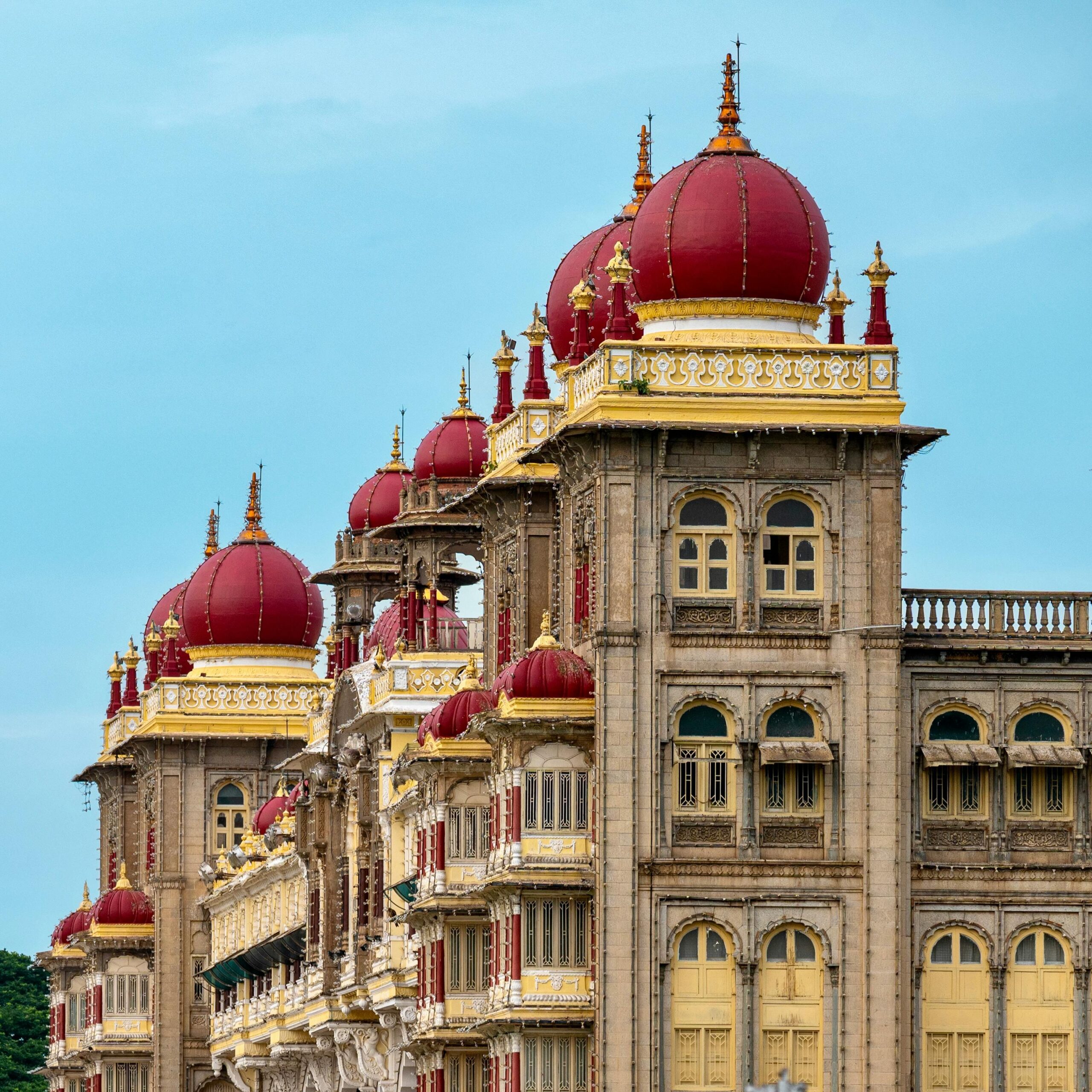 Stunning architectural view of Mysore Palace with vibrant domes in Mysuru, India.